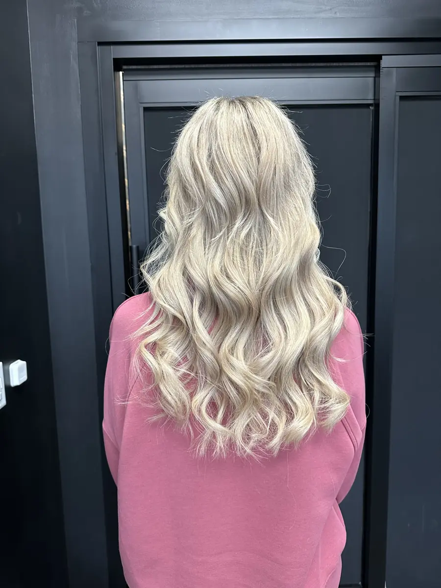After: full, long blonde waves with extensions